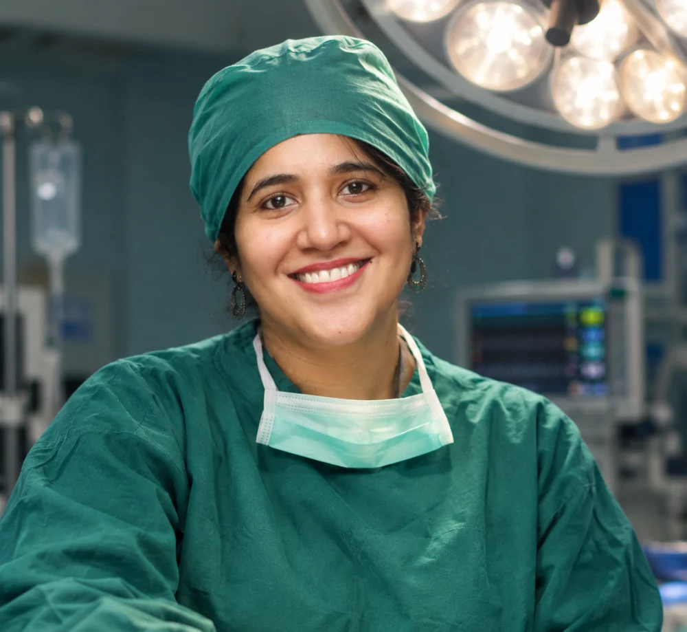 Dr. Nitika Grover in surgical scrubs in an operating theatre